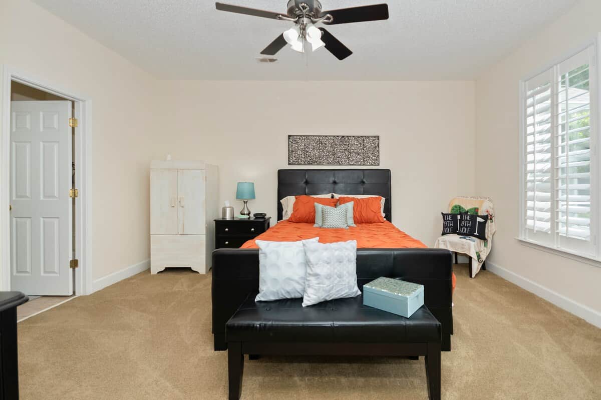 Comfortable first-floor primary suite with a queen bed and private bath.