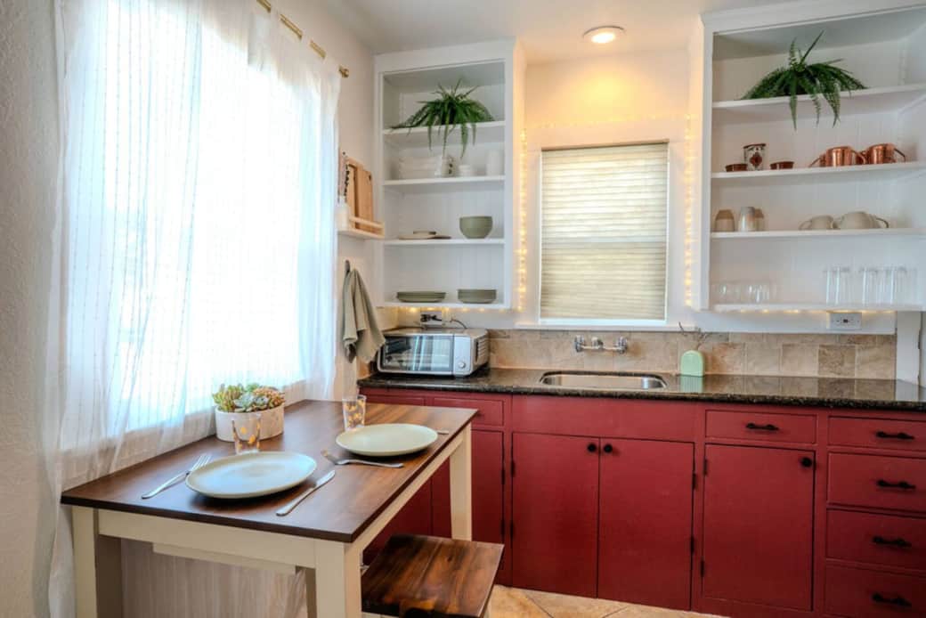 Dining area is set up for four guests with more seating options outside. Full sized kitchen sink, combination counter appliance that: airfry's, bakes, toasts, broils, has "pizza" mode and more. 