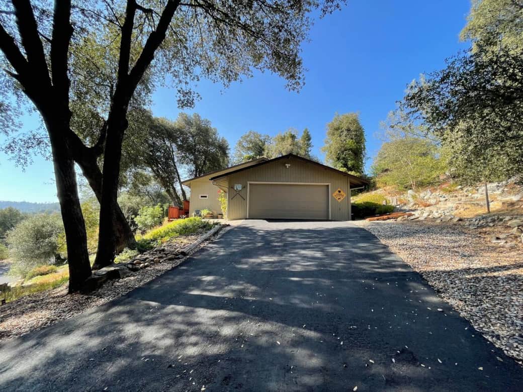 The spacious driveway can easily fit 4 cars. As you exit your car you're greeted by the gorgeous view of the surrounding mountains.