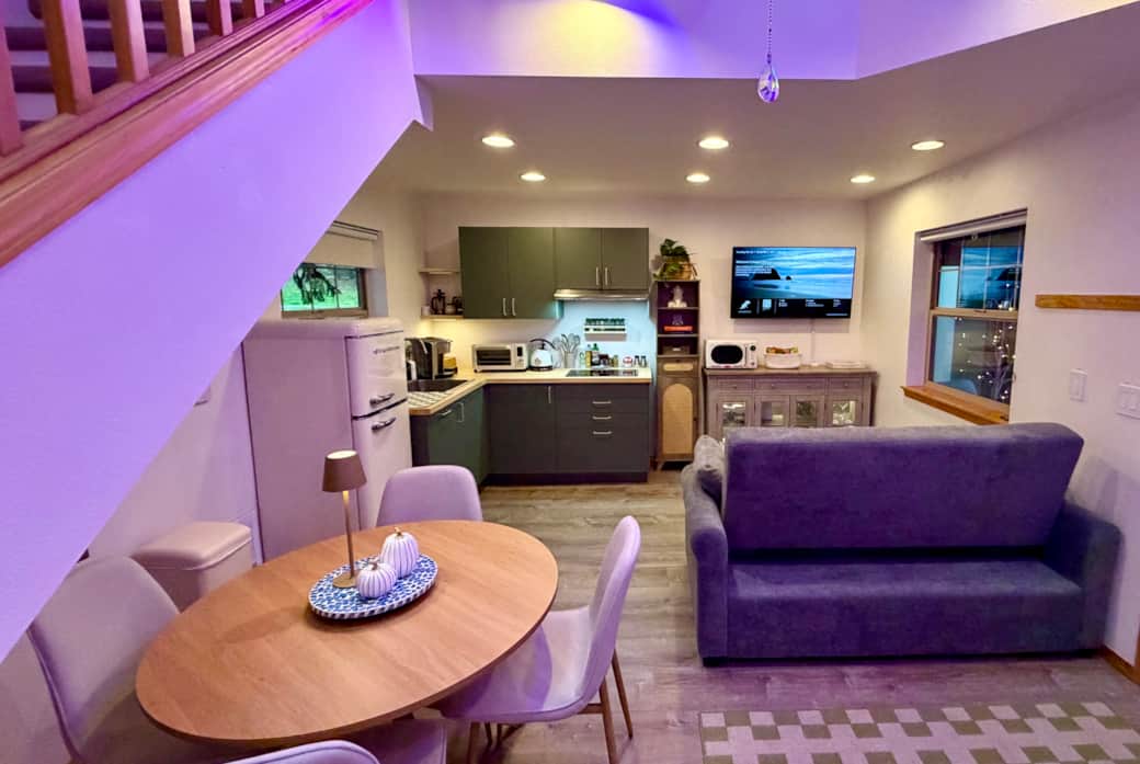 Enjoy meals at the cozy dining table for four, or cook in the fully equipped kitchenette.