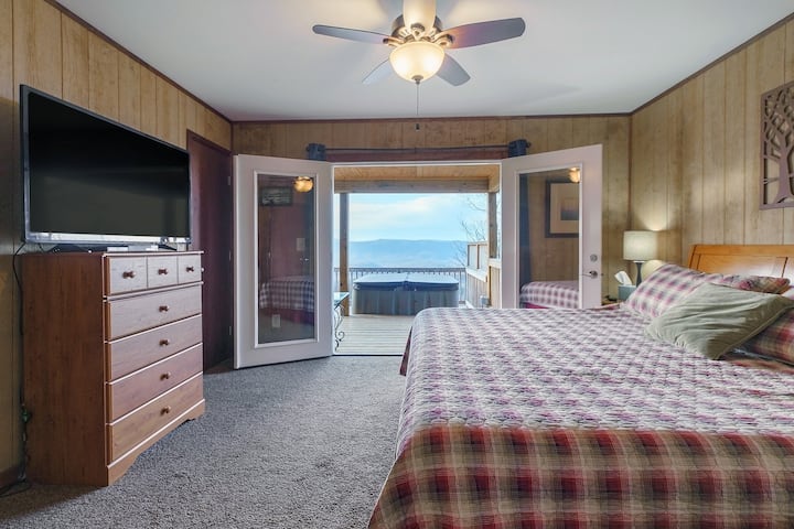 Secluded bliss: this cabin's king-size master bedroom offers a stunning view.