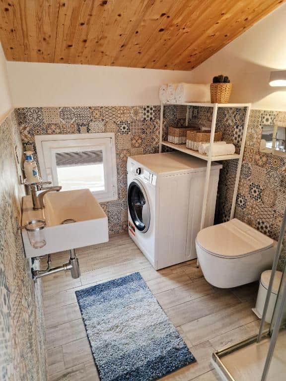 Bathroom on the top floor with washing machine