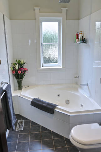 Main bathroom, underfloor heating, raindrop shower and spa bath