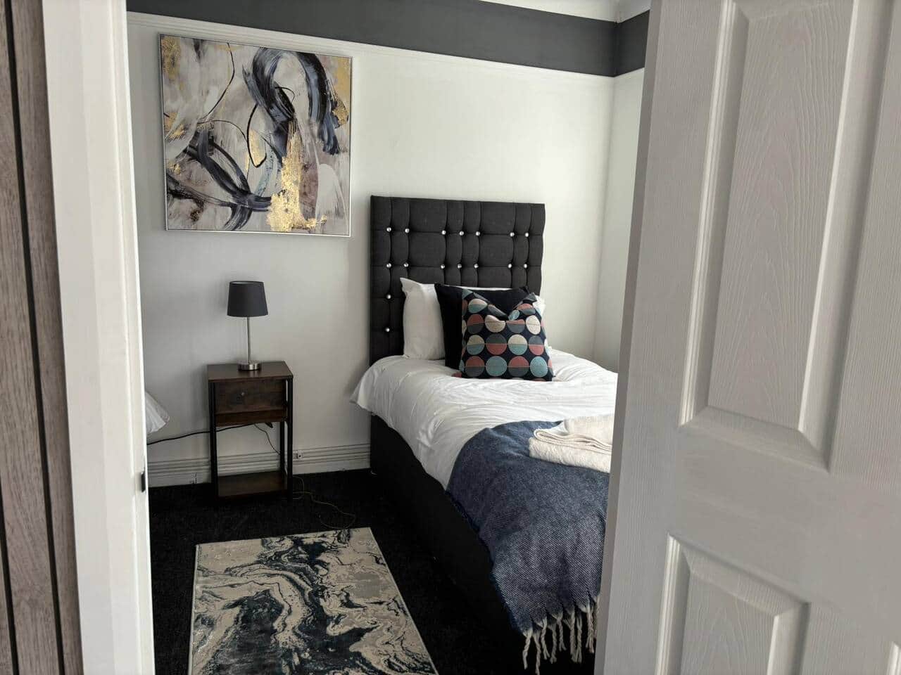 Unwind in our cozy and comfortable bedroom, perfect for a restful night's sleep. Book your stay now!