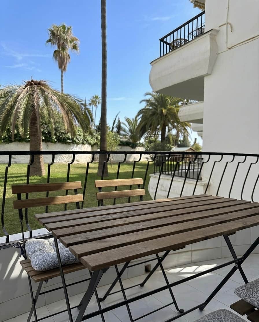 Terrace with chairs and garden views, holiday apartment Nerja Acapulco beach