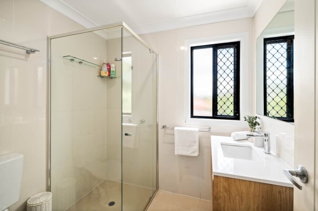 Bathroom: Stylish bathroom with walk-in shower, vanity, and clean finishes 
