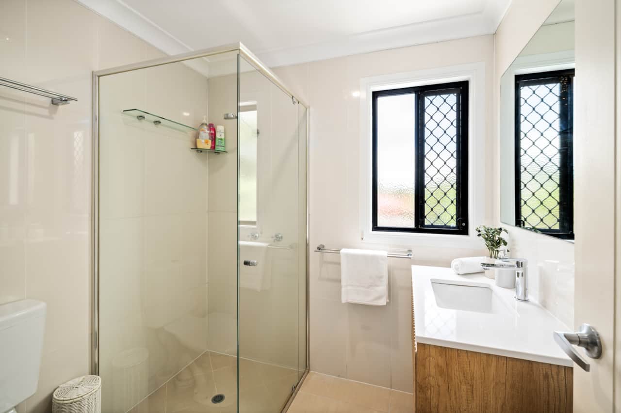 Bathroom: Stylish bathroom with walk-in shower, vanity, and clean finishes 