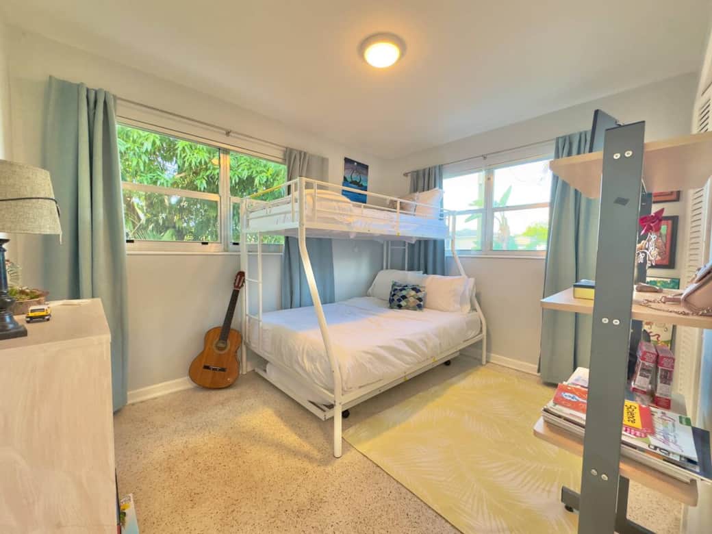 edroom 2 good size with children toys and board games + DVD an other games. Bedroom features a queen size on the bottom bunk and a single on the top. There is also another single under the queen bed for more sleeping arrangements 