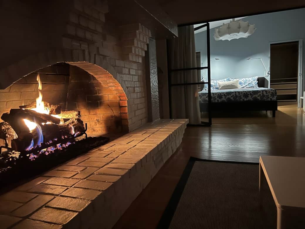 Cozy gas fireplace next to owner's suite
