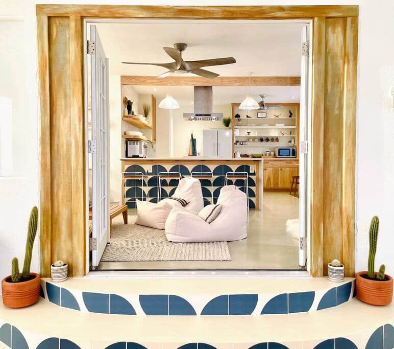 Double doors lead from the sun room into the kitchen and living space. | La Choza