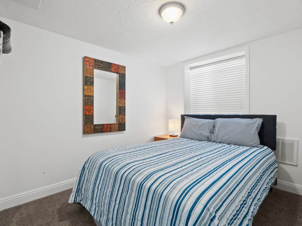 There are two single-queen beds downstairs.