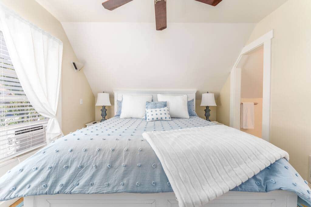 Upstairs bedroom #2 with California King bed. Ensuite bathroom and TV Upstairs bedroom #2 with California King bed. Ensuite bathroom and TV