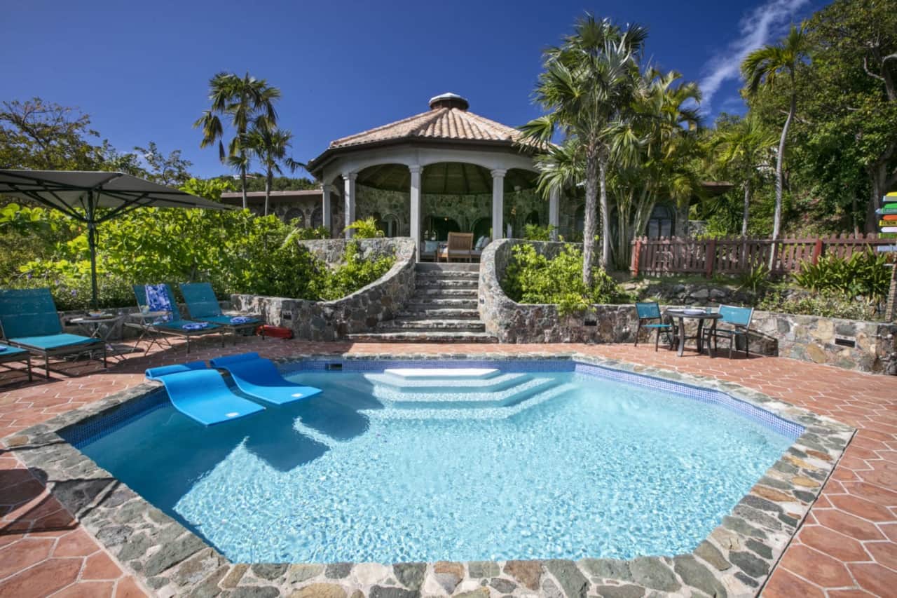 View from pool facing home and outdoor rotunda
