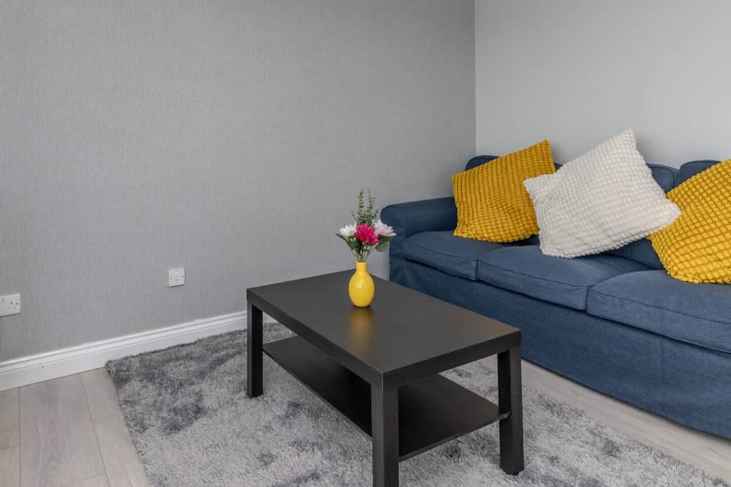 Relaxing lounge with cosy sofa and TV