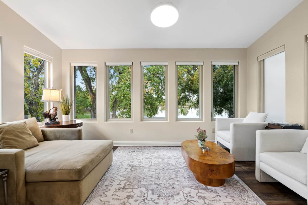 Glass sunroom over the lake — record player and slow mornings