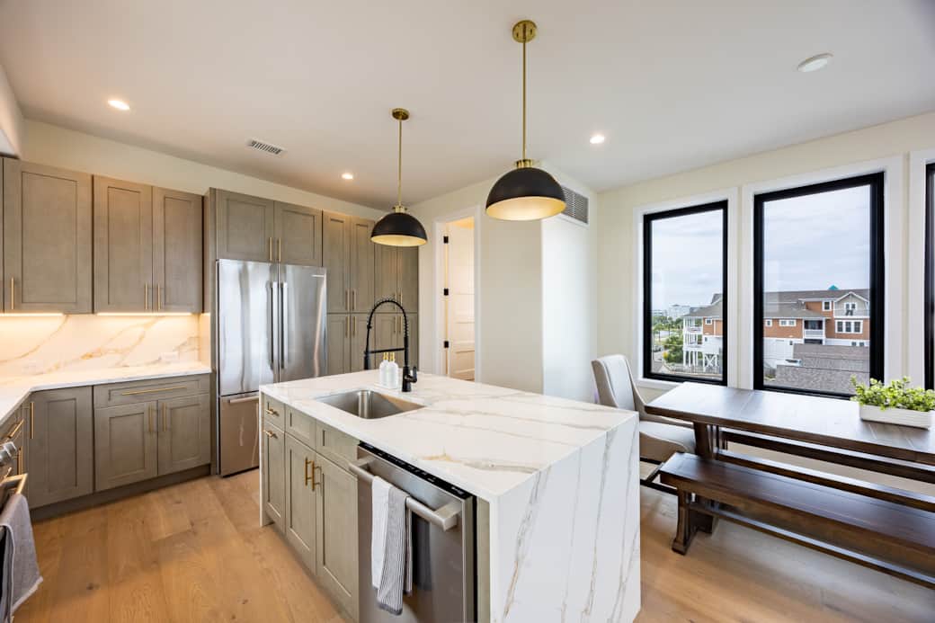 Modern kitchen with island at Driftwood Carolina luxury beach house