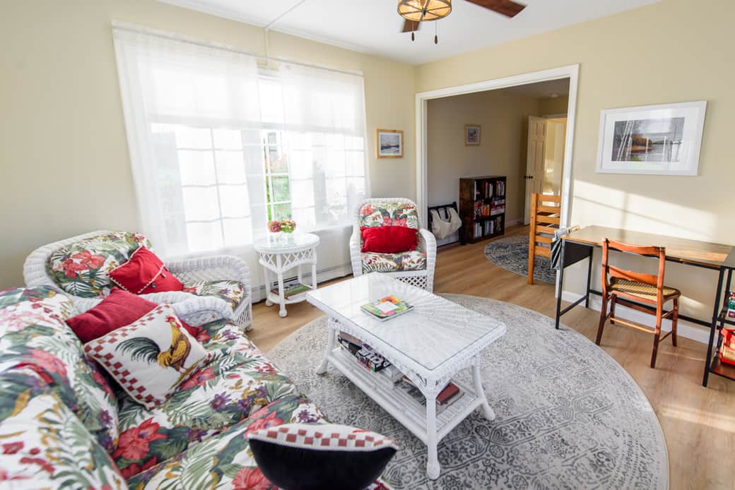 The sunroom also has a dedicated work space/desk with basic office supplies.