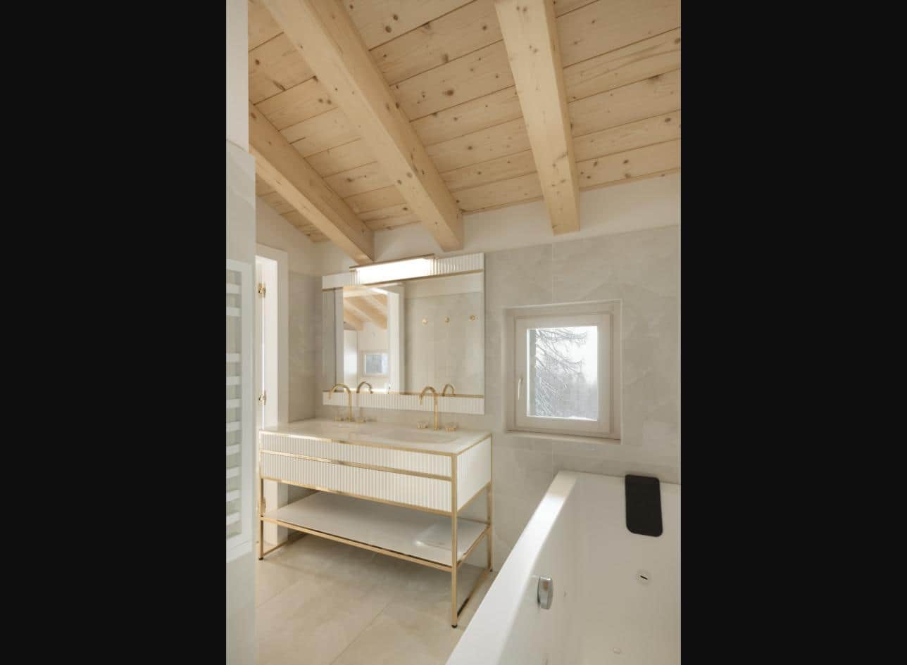 Master bathroom with bath, double vanity and window