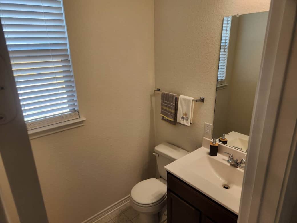 Half bath conveniently located near the backyard patio.