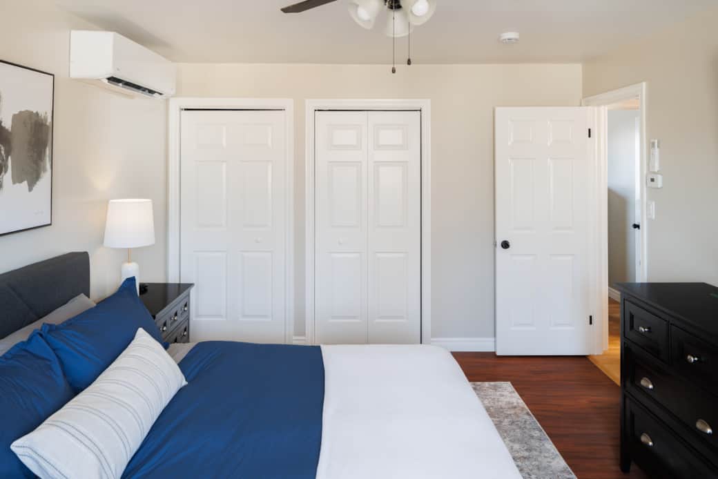 Bright, comfortable master bedroom with king bed