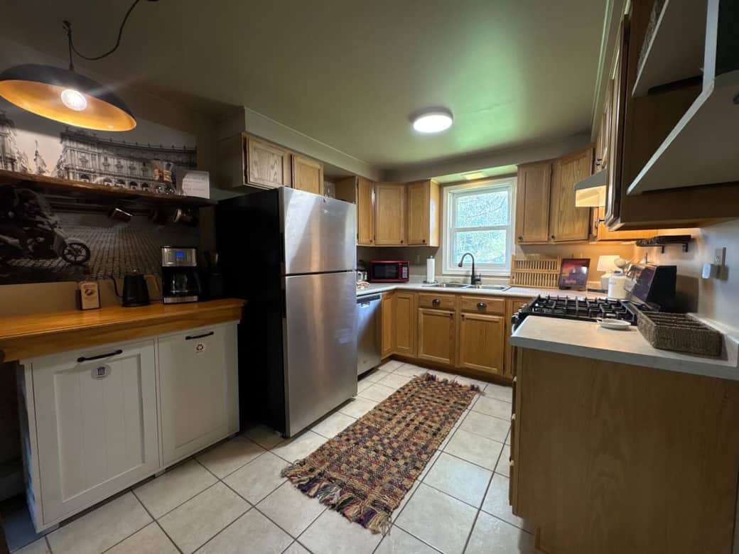 Kitchen includes Coffee bar, five burner stove, oven, dish washer, hot and cold water dispenser, toaster blender, and more.